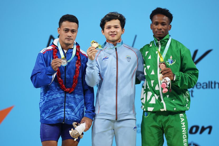 (L-R) Silver medalist Vaipava Nevo Ioane of Team Samoa, gold medalist Lalrinnunga Jeremy of Team India and bronze medalist Edidiong Joseph Umoafia of Team Nigeria