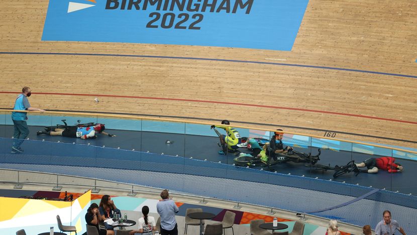 Riders lie on the track following a massive crash during the men's 15km scratch race qualifying round cycling event on day three of the Commonwealth Games, at the Lee Valley VeloPark