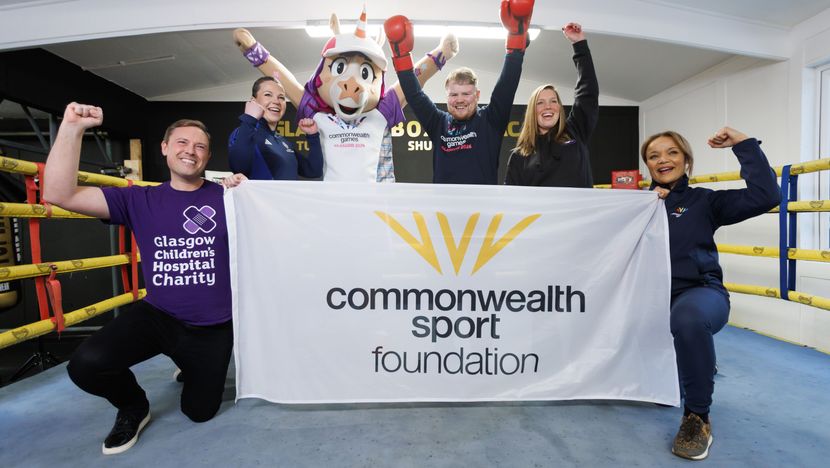 Finnie and Charlie Flynn with representatives from Glasgow 2026 charity partners