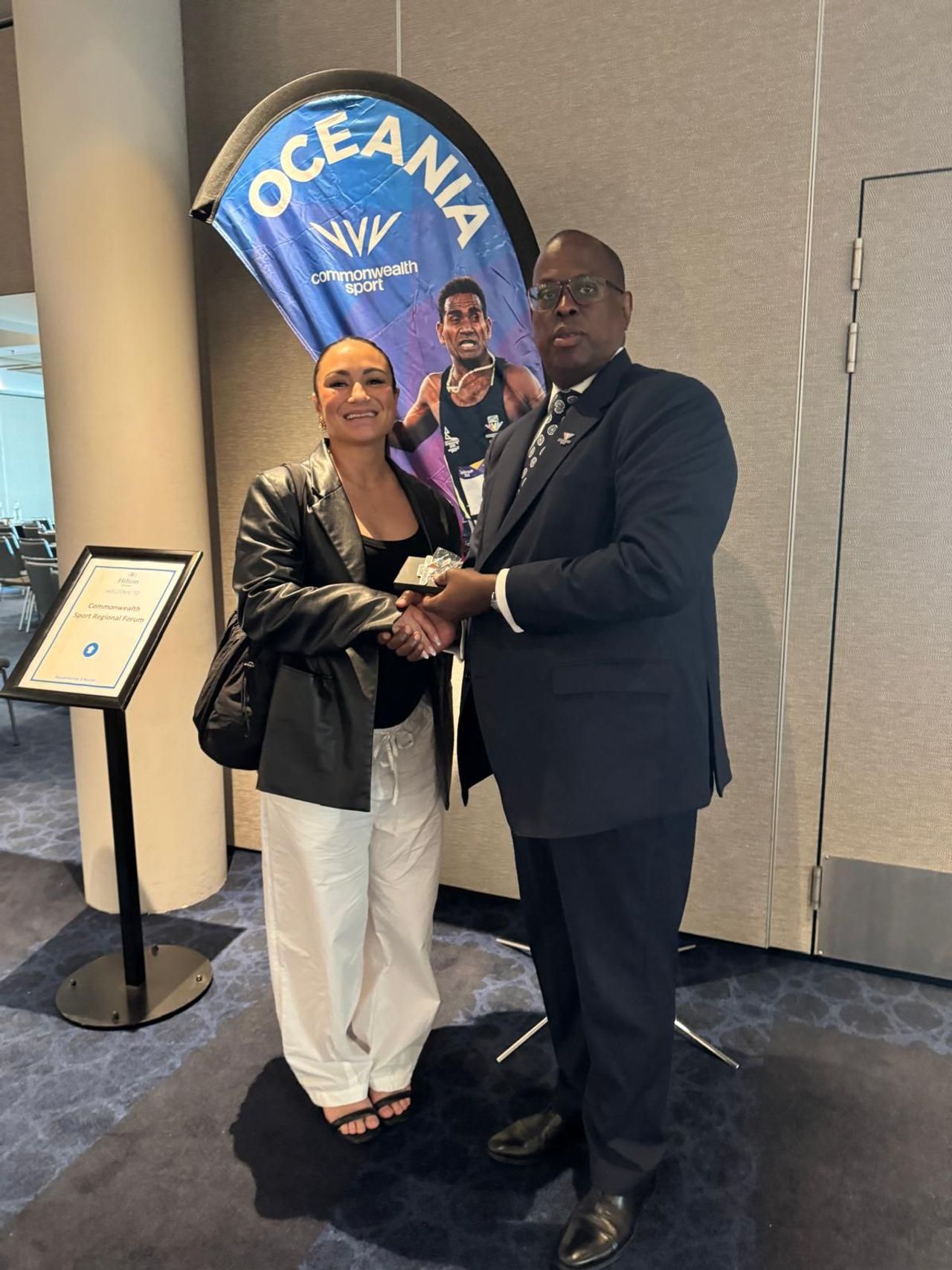 Megan Signal, Birmingham 2022 athlete and Game Changers grant recipient with the CS President.