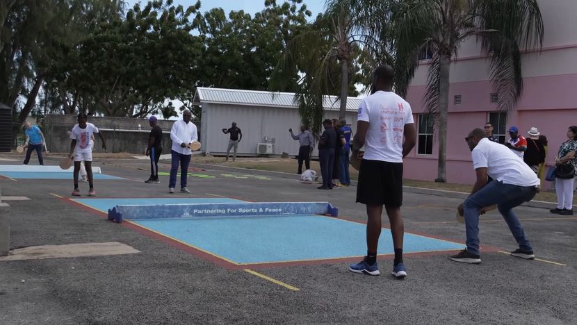 CS Executive Board members learning to play Road Tennis in Barbados