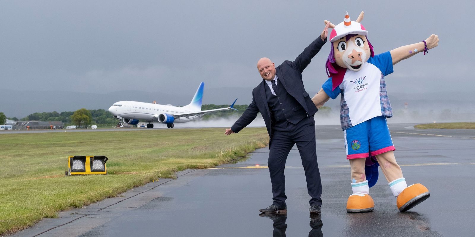 Finnie steps hoof on to the Glasgow Airport runway with Gavin Birch-Williams (MD of Glasgow Airport)