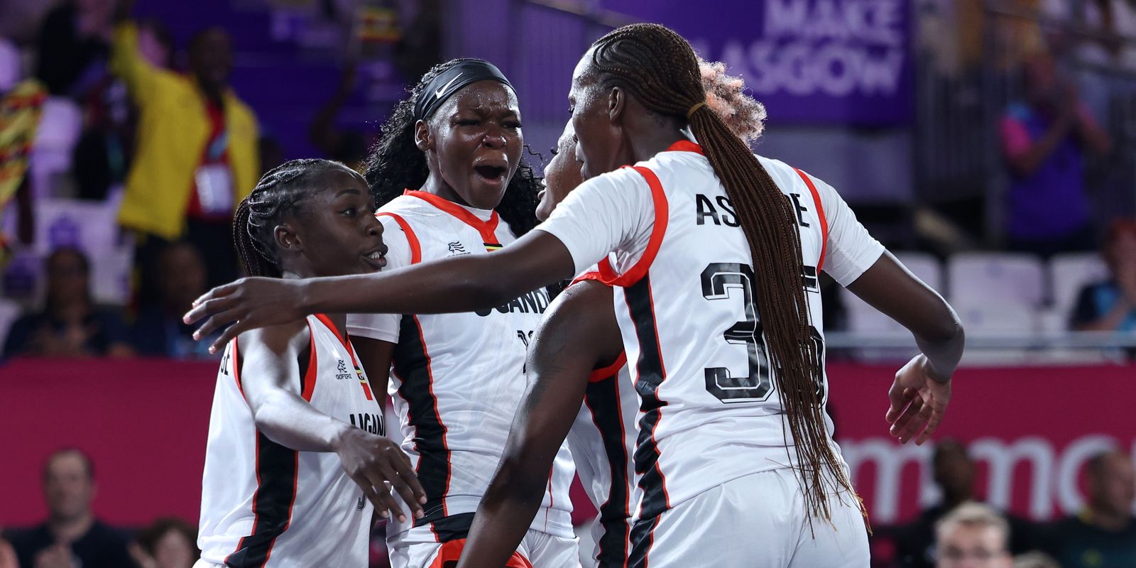 Melissa Akullu of Team Uganda celebrates with teammates after their victory against Team Jamaica