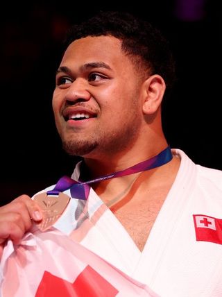 G2026: Bronze medalist Paula Monta of Team Tonga at the medal ceremony for the Men's +100kg